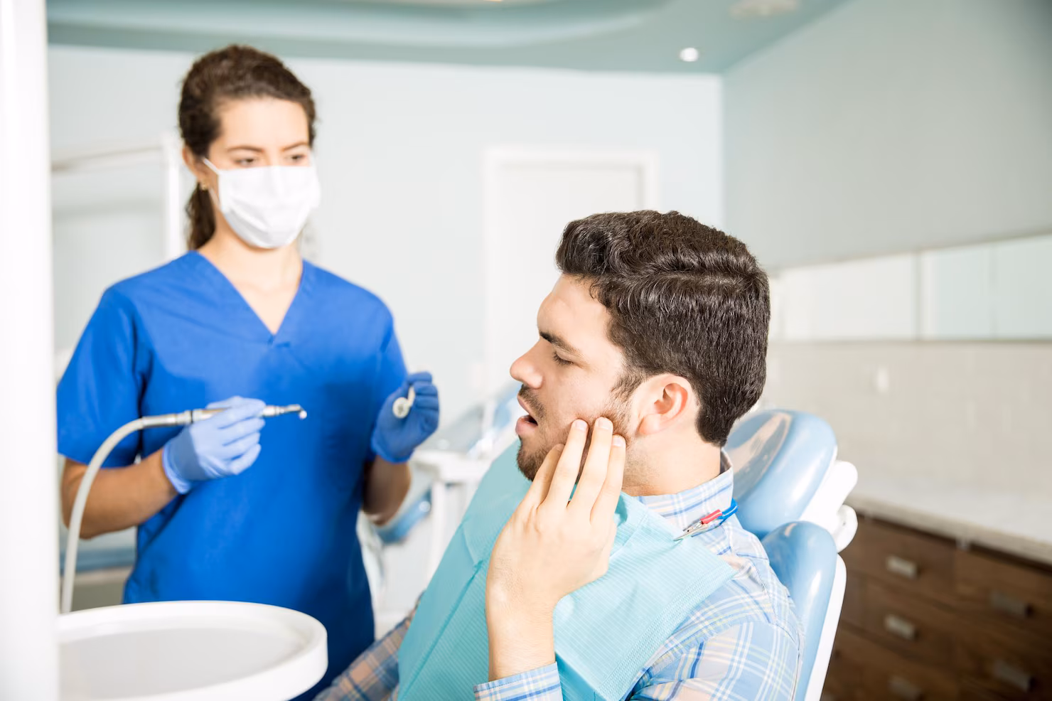 Patient getting relief from tooth sensitivity through dental care